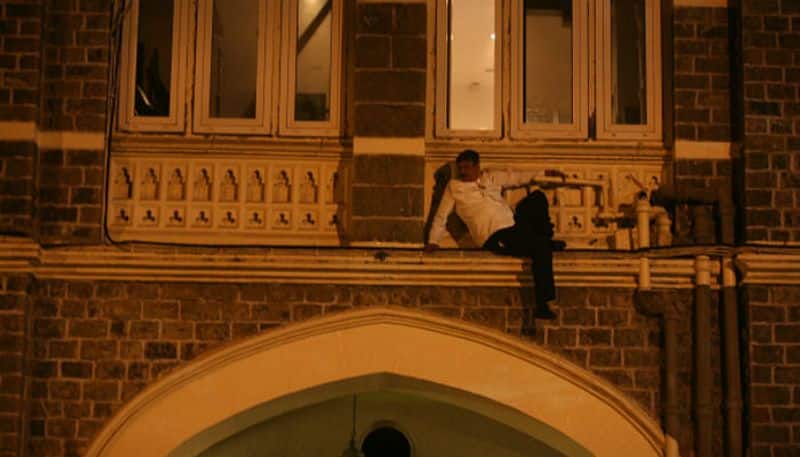 A man is seen taking cover during the attack.