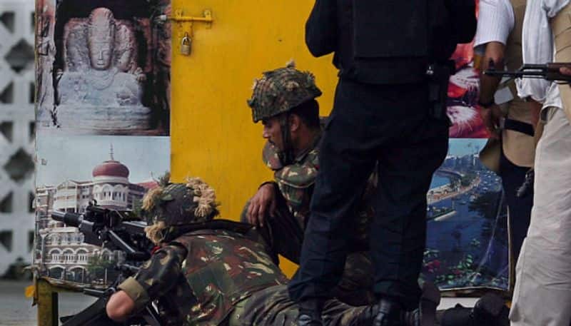 NSG commandos are seen fighting the terrorists. The last of the terrorists were firing from the first floor corner room in old wing of Taj Palace.