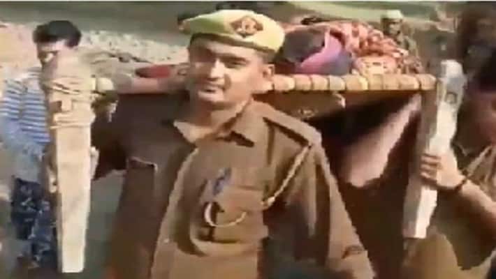 UP police officials save burn victim UP police officials save burn victim