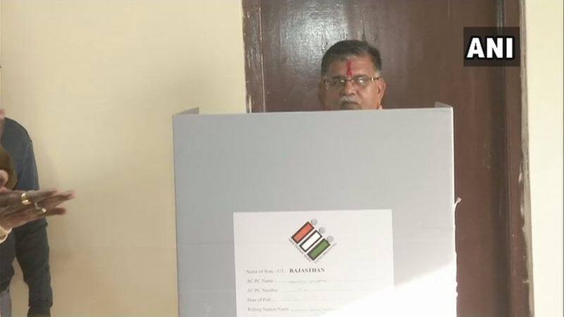 Rajasthan state home minister Gulab Chand Kataria cast his vote at a polling station in Udaipur.