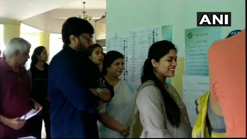 Actor Chiranjeevi stands in a queue to cast his vote at polling booth no. 148 in Jubilee Hills, Hyderabad.