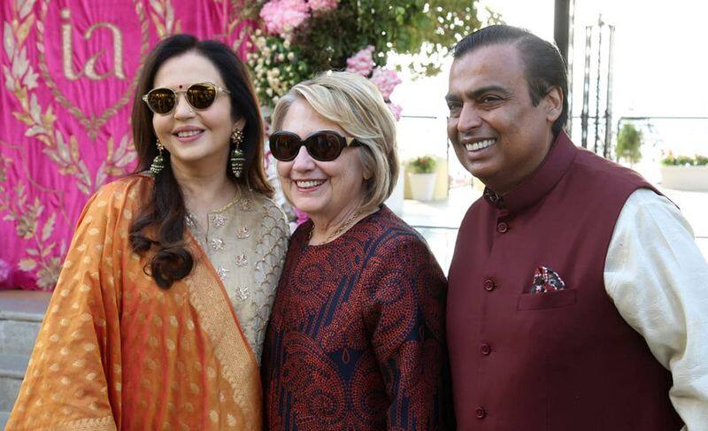 Hilary Clinton adds a videsi punch to a very desi wedding, pictured here with parents of the bride- Mukesh Ambani and Nita Ambani.