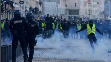 Who are France yellow vest protesters what do they want Macon fuel price