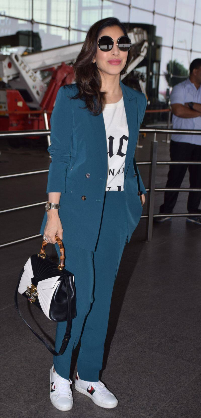 Winter formal wear does not always have to be black or brown. Get inspired by Sophie Choudry to stay snug in a teal pantsuit.