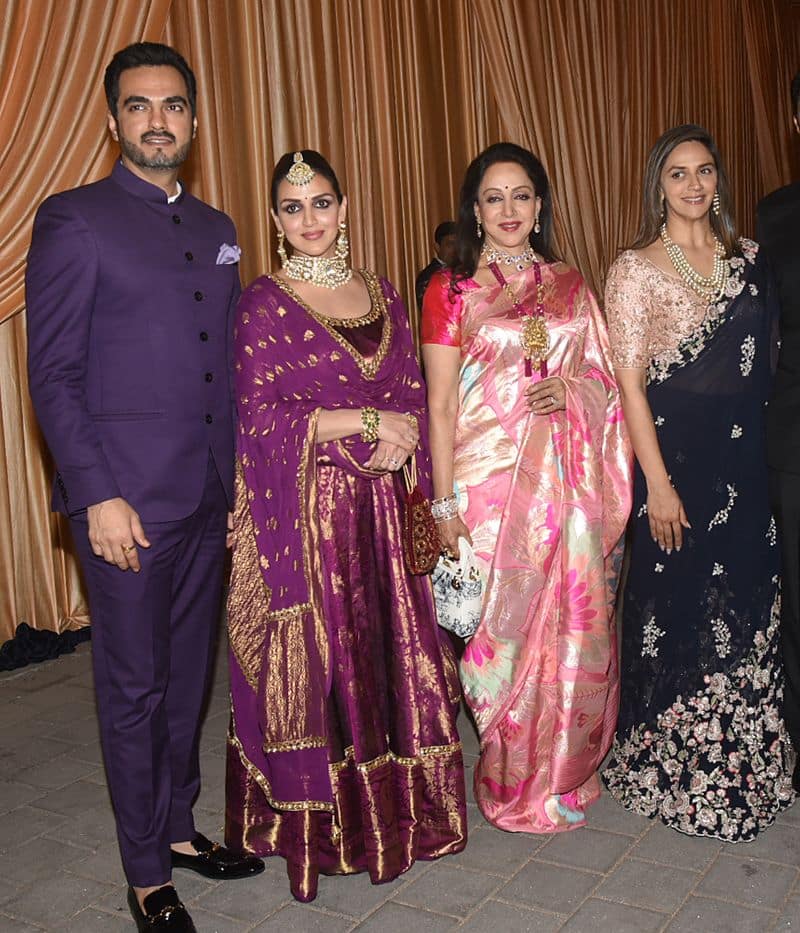 Esha Deol and husband Bharat Takhtani attend the wedding reception with Hema Malini and Ahana Deol.