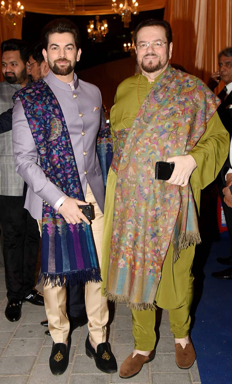 Neil Nitin Mukesh and father Nitin Mukesh look dapper in twin outfits for Isha Ambani, Anand Piramal wedding reception.