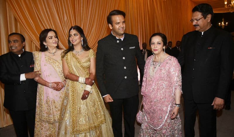 Isha Ambani and Anand Piramal flanked by their respective parents.