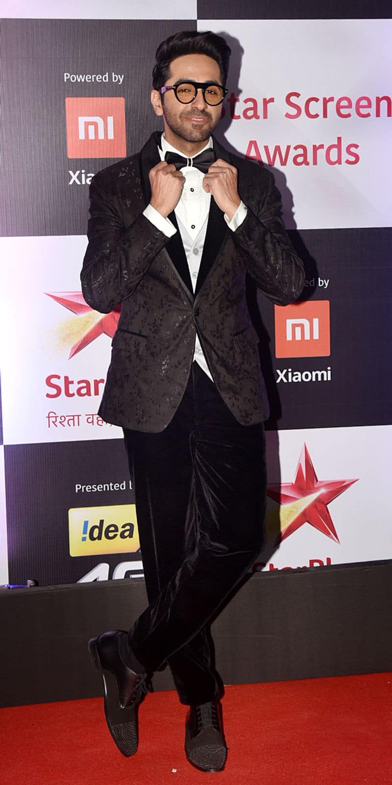 Bow-tie and tinted glasses, Ayushmann Khurrana reps the tuxedo style in velvet.