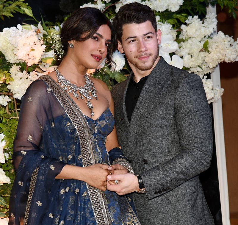 Husband Nick Jonas also looked dapper in his charcoal grey suit that complemented PeeCee's outfit too.