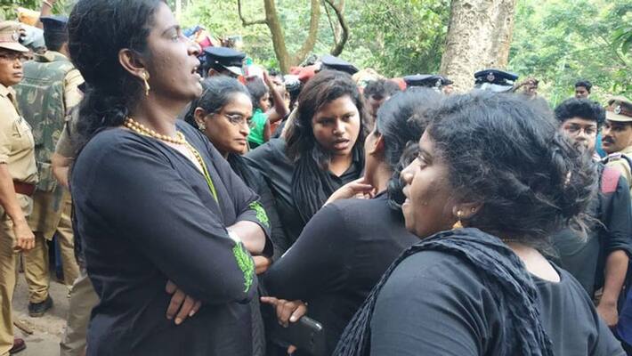 Lord Ayyappa devotees hold a protest before the group of women devotees who are gathered at Pampa base camp Lord Ayyappa devotees hold a protest before the group of women devotees who are gathered at Pampa base camp