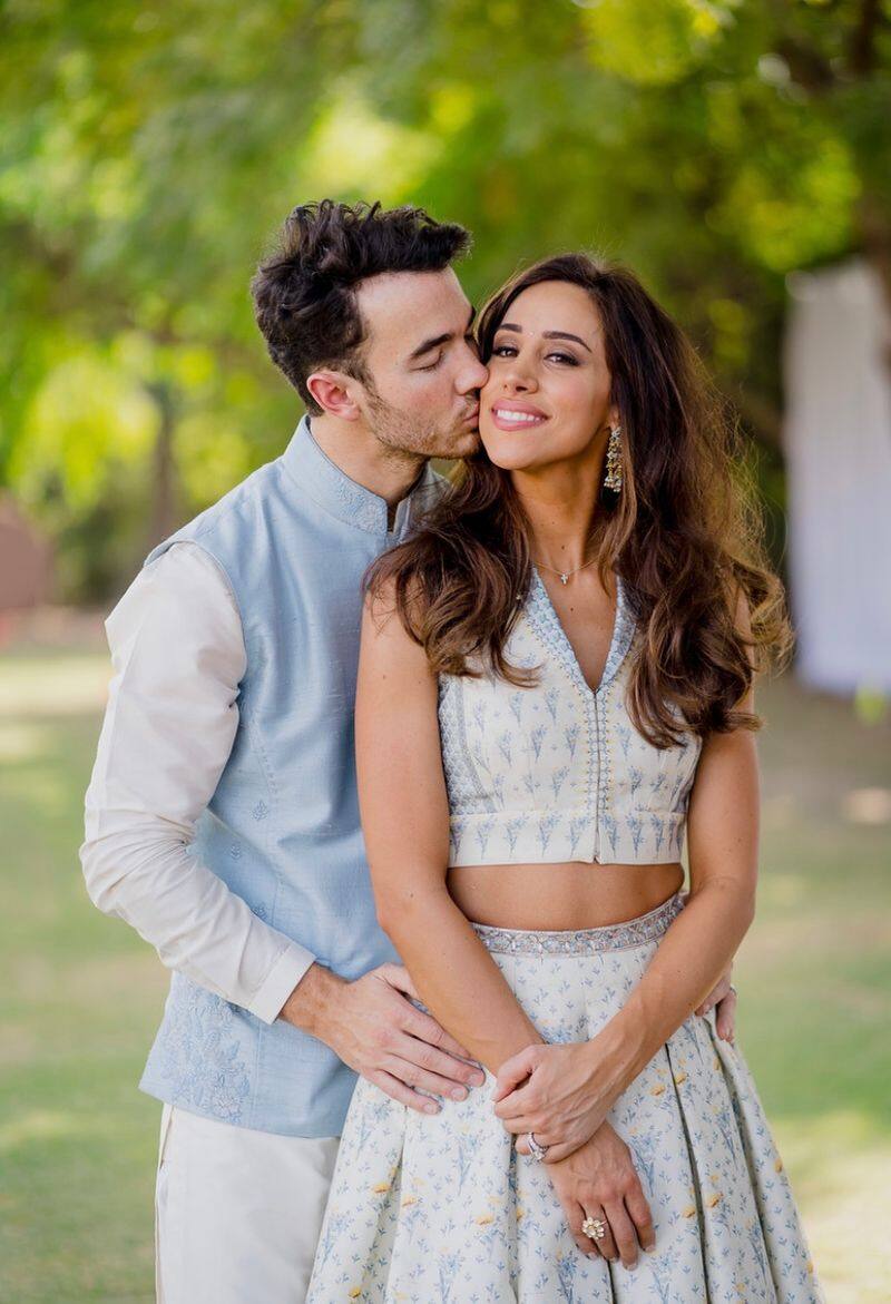 Kevin Jonas and wife Danielle paint a perfect picture with their pastel blue Anita Dongre outfits.