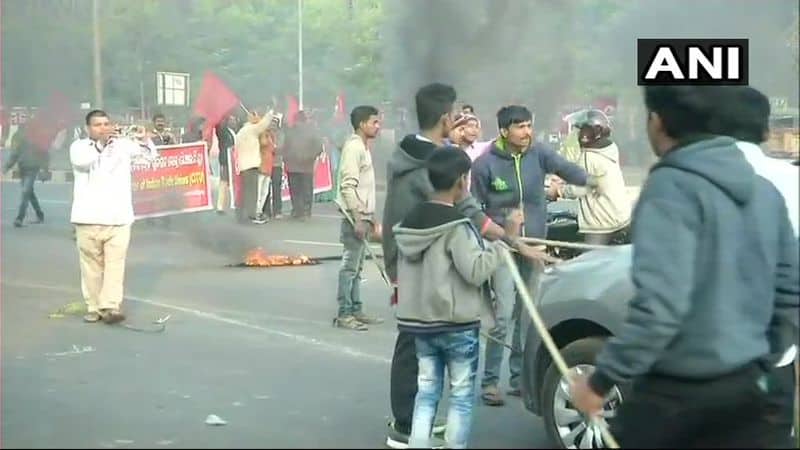 Visuals from Odisha: Members of Central Trade Unions hold protests and block commuters in Bhubaneswar