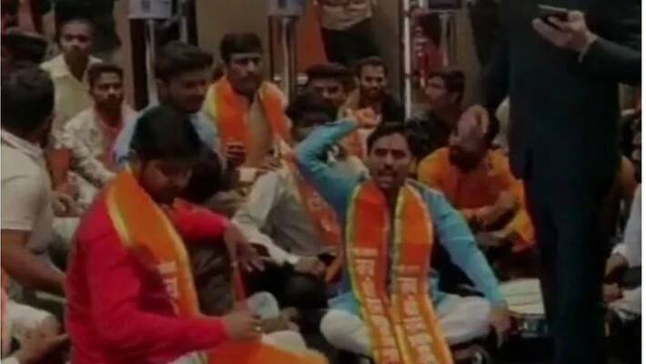shiv sena workers protest inside theater for not exhibiting Thackeray poster shiv sena workers protest inside theater for not exhibiting Thackeray poster