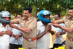 Tamil Nadu inspector Ambedkar  distributes free helmets Narikurava community video