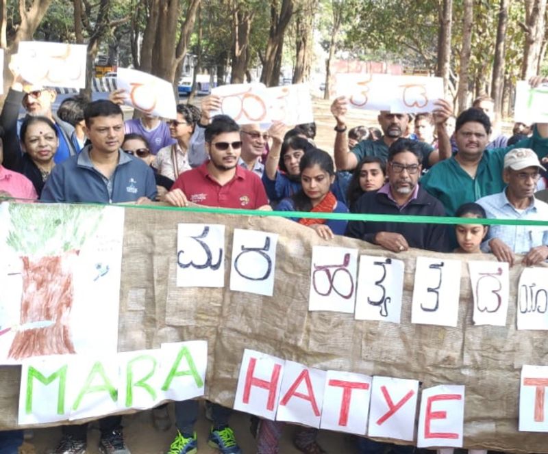 Members of Citizens for Bangalore staged a protest in front of Cauvery Junction demadning to protect trees from felling