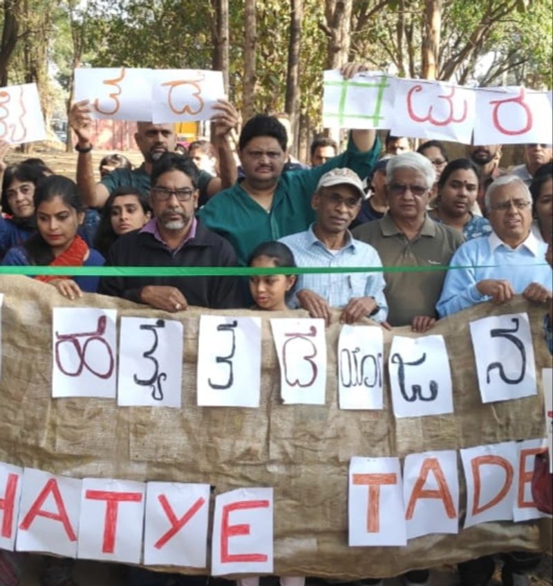 Members of Citizens for Bangalore staged a protest in front of Cauvery Junction demadning to protect trees from felling