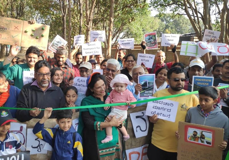 Members of Citizens for Bangalore staged a protest in front of Cauvery Junction demadning to protect trees from felling