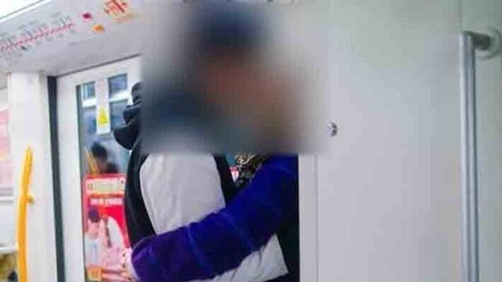 lovers kissing in metro station premises lovers kissing in metro station premises