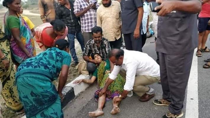 TRS Mp Dr Boora Narsaiah Goud Giving first aid to the accident victim TRS Mp Dr Boora Narsaiah Goud Giving first aid to the accident victim