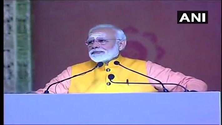 Modi takes holy dip at 'Kumbh Mela', honours sanitation workers Modi takes holy dip at 'Kumbh Mela', honours sanitation workers