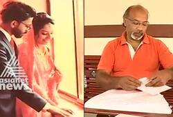 Kerala couple hands wedding invitation book encourage reading