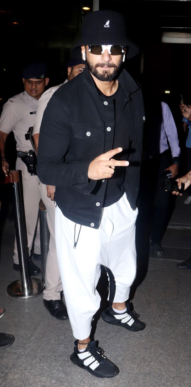 DeePee's hubby dearest, Ranveer Singh, looks to be attempting another 'sperm airport look' though this one seems more comfortable. He does wear the quirky glasses well though.