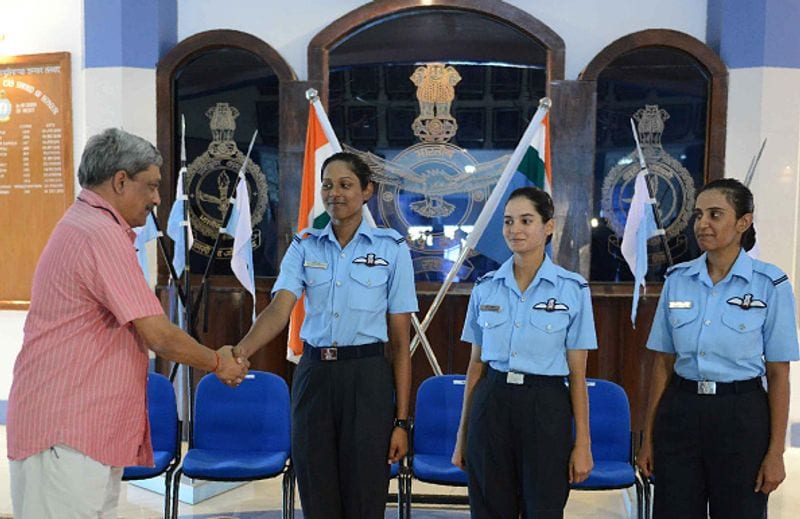 Manohar Parrikar (L) congratulated three of the Indian Air Force's fighter pilots Bhawana Kanth (L), Avani Chaturvedi (C) and Mohana Singh after the combined graduation parade at the air force academy at Dundigal in Hyderabad on June 18, 2016. The first three women fighter pilots of the Indian Air Force had been conferred with the President's commission, and 22 women trainees were commissioned as flying officers from the Air Force Academy.