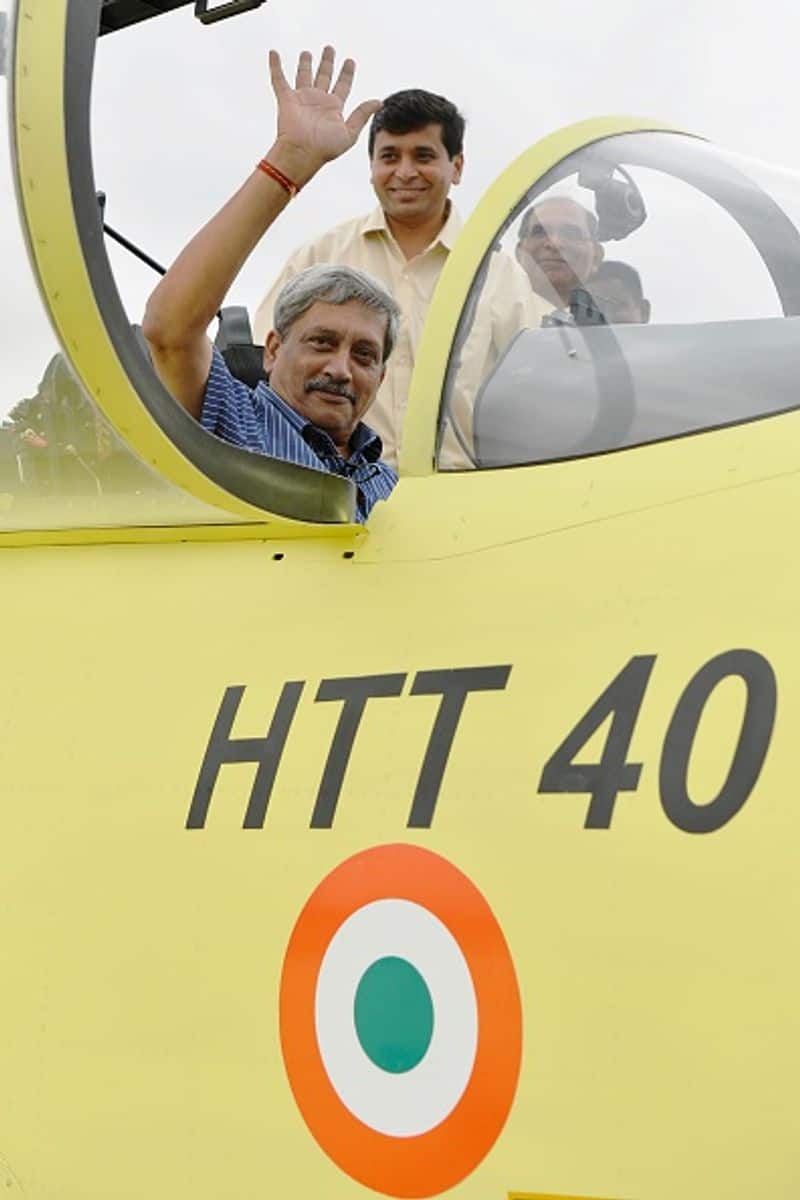 Manohar Parrikar posed for a photograph from the cockpit of a Hindustan Turbo Trainer-40 (HTT-40) aircraft developed by Hindustan Aeronautics Limited (HAL) after its first test flight in Bangalore on June 17, 2016.