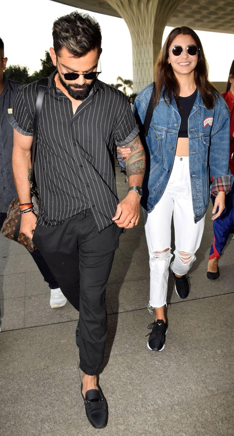 Cricketer Virat Kohli and actor Anushka Sharma were spotted jet-setting in monotone outfits.
