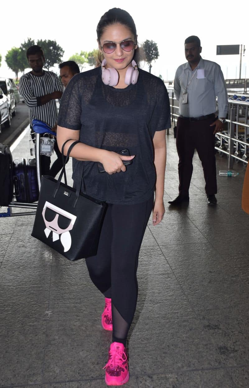 Huma Qureshi also channeled sweaty gym vibes with her airport look. The sparkling pop pink Adidas trainers and Karl Lagerfeld bag are going straight into our Must-Have list.