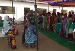 Security personal helping elderly people in Naxal Affected Bastar