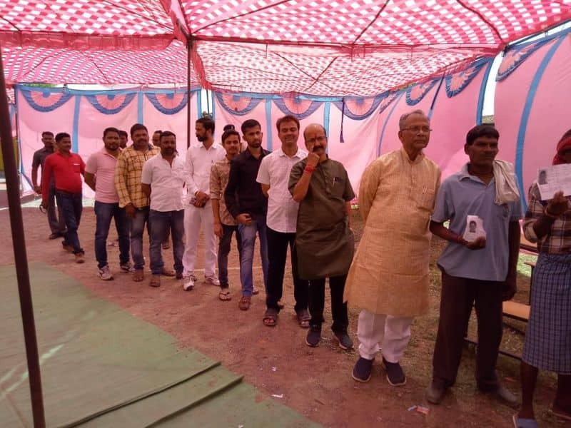 Chhattisgarh home minister Tamradwaj Sahu also stood in line to exercise his franchise at a polling centre in Durg district