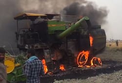 combine machine caught fire in field during harvesting wheat