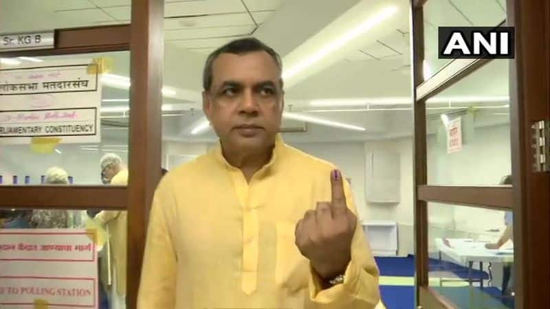 BJP sitting MP Paresh Rawal casts their vote at polling booth number 250-256 at Jamna Bai School in Vile Parle.