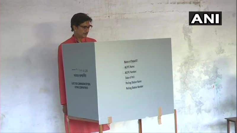 BJP MP candidate from Jhansi, Anurag Sharma casts his vote at a polling booth in Jhansi.
