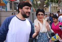 Actress sonali bendre casts vote in mumbai with husband goldi bahal