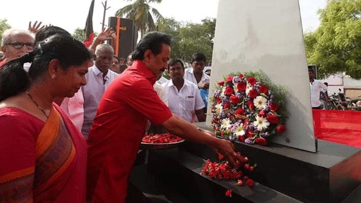 mk stalin and kanimozhi in red clothing