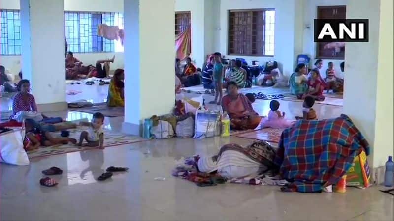 People take refuge in a shelter in Paradip of Jagatsinghpur. Over 1 million people have been evacuated from vulnerable districts in the last 24 hrs and about 5000 kitchens are operating to serve people in shelters.