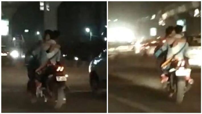 A romantic couple lip kiss on road, a dangerous journey A romantic couple lip kiss on road, a dangerous journey