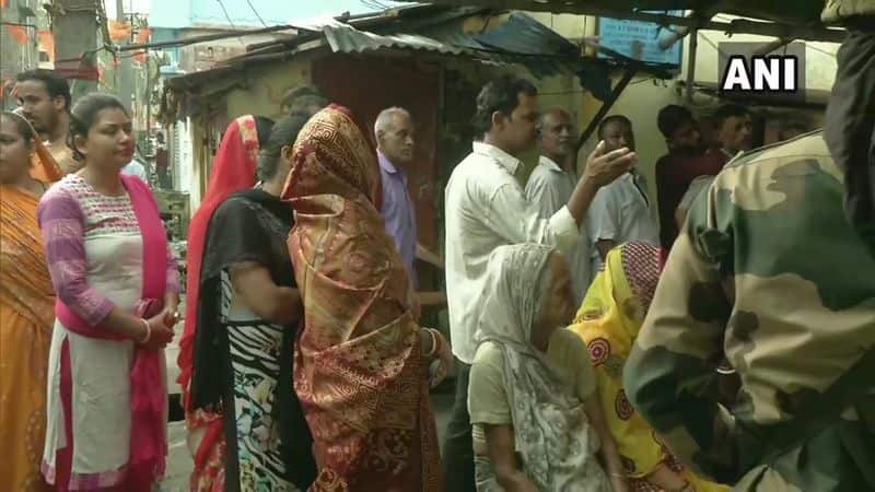 Voters queue up outside a polling station in Barrackpore in Bengal. Sporadic violence marred the 4th phase of elections in Bengal