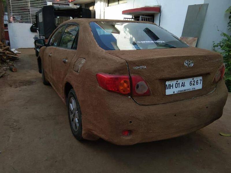 Toyota Corolla Altis car pasted with cow dung to avoid summer heat