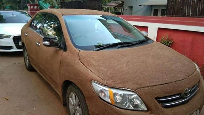 Ahmedabad Driver Coats Car With Cow Dung To Cool It As Temperatures Soar Ahmedabad Driver Coats Car With Cow Dung To Cool It As Temperatures Soar