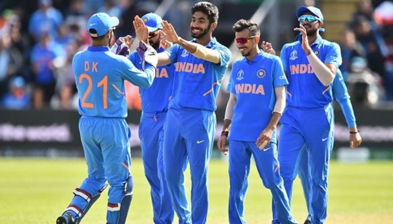 Jasprit Bumrah (centre) celebrates with teammates after taking the wicket of Bangladesh's Shakib Al Hasan for a duck