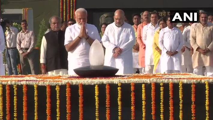 Prime Minister Narendra Modi pays tribute to Mahatma Gandhi at Rajghat Prime Minister Narendra Modi pays tribute to Mahatma Gandhi at Rajghat