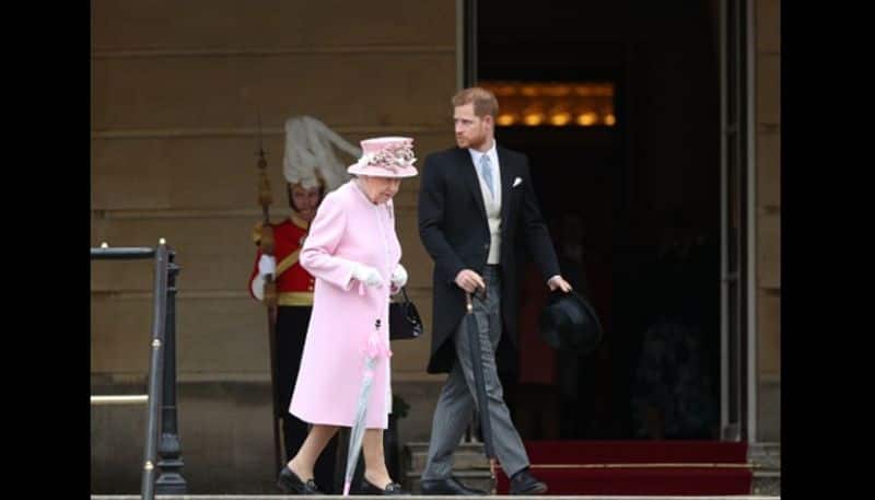 Queen Elizabeth II and Prince Harry, Duke of Sussex attend the Royal Garden Party at Buckingham Palace