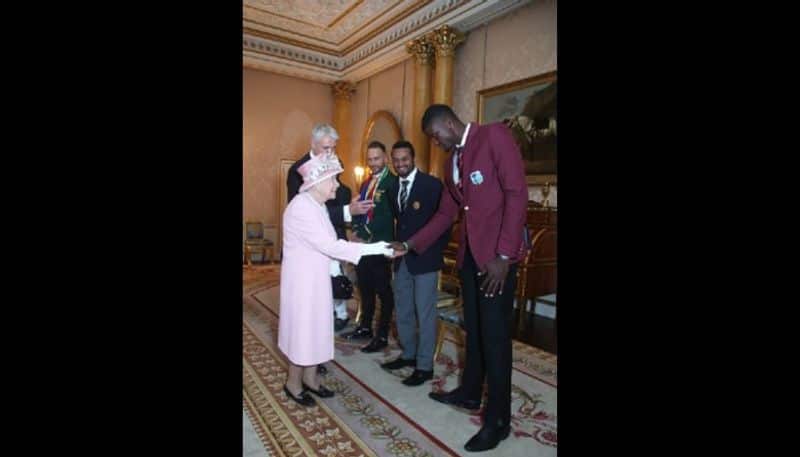 Queen Elizabeth talks to West Indies captain Jason Holder