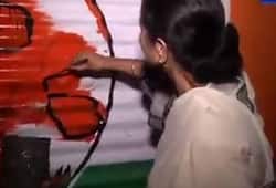 Mamata draws trinamool symbol on BJP office walls claims it belonged to her