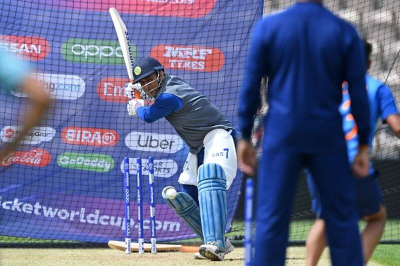MS Dhoni prepares to hit a big one as he bats in the nets