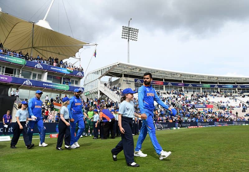 Virat Kohli leads the Indian team on to the field
