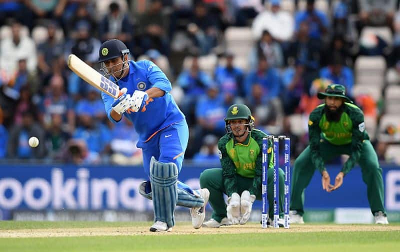 Dhoni plays a shot. He made 34